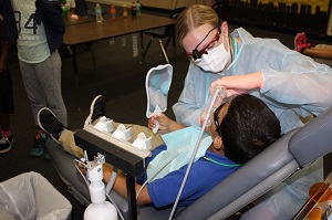 Broward County third grader receives dental sealant treatment